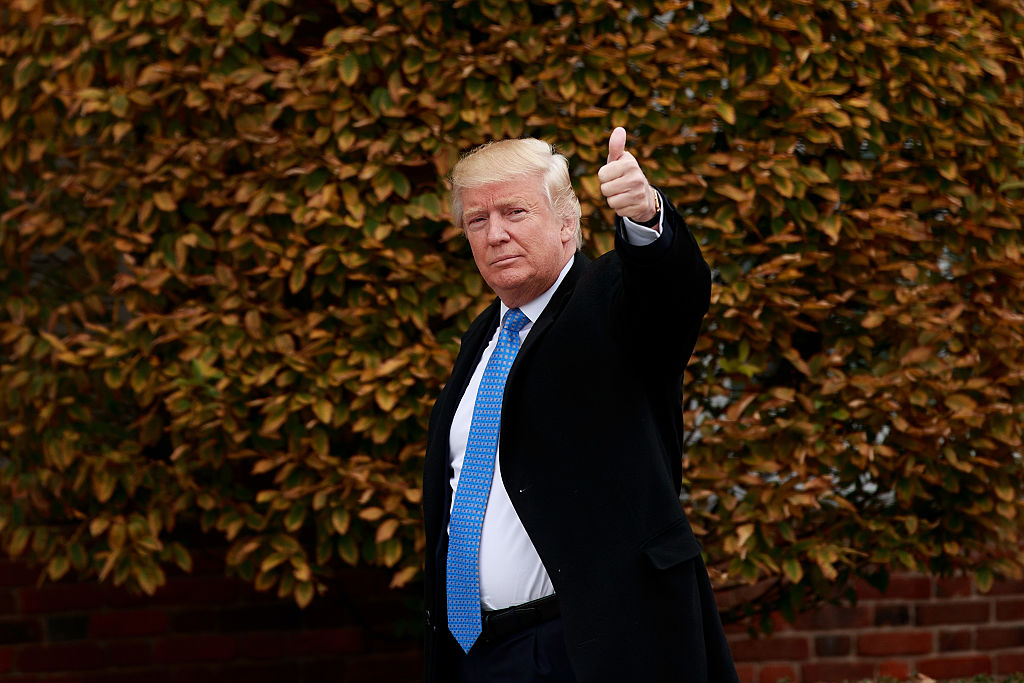 BEDMINSTER TOWNSHIP, NJ - NOVEMBER 20: President-elect Donald Trump waves as he arrives at Trump International Golf Club for a day of meetings, November 20, 2016 in Bedminster Township, New Jersey. Trump and his transition team are in the process of filling cabinet and other high level positions for the new administration.  (Photo by Drew Angerer/Getty Images)